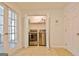 Well-lit laundry room features a washer and dryer inside of a closet behind bi-fold doors at 345 Summer Pl, Peachtree City, GA 30269