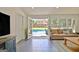 Living room features a tile floor and French doors to the swimming pool at 345 Summer Pl, Peachtree City, GA 30269
