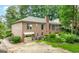 Back of brick home with a screened porch and a large backyard at 1919 Lake Lucerne Sw Way, Lilburn, GA 30047