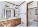 Double vanity in bathroom with a connecting room with a bathtub at 1919 Lake Lucerne Sw Way, Lilburn, GA 30047