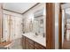 Bathroom features vanity with cabinet, shower, and decorative accents at 1919 Lake Lucerne Sw Way, Lilburn, GA 30047