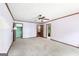 Bedroom featuring neutral carpet, ceiling fan, and multiple closets at 1919 Lake Lucerne Sw Way, Lilburn, GA 30047