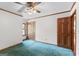 Bedroom with ceiling fan, trim, neutral paint, and carpet flooring at 1919 Lake Lucerne Sw Way, Lilburn, GA 30047