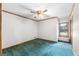 Bedroom with ceiling fan, trim, neutral paint, and carpet flooring at 1919 Lake Lucerne Sw Way, Lilburn, GA 30047