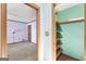 Walk-in closet with painted walls and wood shelving at 1919 Lake Lucerne Sw Way, Lilburn, GA 30047