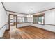 Inviting dining room with hardwood floors, mirrored walls, and views of the lake, perfect for entertaining guests at 1919 Lake Lucerne Sw Way, Lilburn, GA 30047