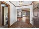 Inviting foyer with hardwood floors leads to a spacious living area, featuring a stone fireplace, hardwood floors and lake views at 1919 Lake Lucerne Sw Way, Lilburn, GA 30047