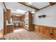 Eat-in kitchen with wood cabinets, beams, a skylight, and modern appliances at 1919 Lake Lucerne Sw Way, Lilburn, GA 30047