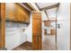 Entryway to laundry room, stainless steel refrigerator, and updated kitchen at 1919 Lake Lucerne Sw Way, Lilburn, GA 30047