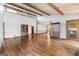 Spacious living room featuring hardwood floors, tall ceilings, and an open floor plan with ample natural light at 1919 Lake Lucerne Sw Way, Lilburn, GA 30047