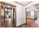 Welcoming living area features hardwood floors, access to a well-appointed kitchen, and picturesque views of the lake at 1919 Lake Lucerne Sw Way, Lilburn, GA 30047