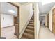 Carpeted stairway with access to basement rooms at 1919 Lake Lucerne Sw Way, Lilburn, GA 30047