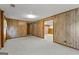 Unfinished basement space with paneled walls and large openings at 110 Mourning Dove S Dr, Fayetteville, GA 30215