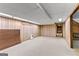 Large unfinished basement space with paneled walls and open ceilings at 110 Mourning Dove S Dr, Fayetteville, GA 30215