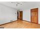 Bedroom with hardwood floors and two doors at 110 Mourning Dove S Dr, Fayetteville, GA 30215