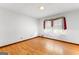 Bright bedroom with hardwood floors and a large window with curtains at 110 Mourning Dove S Dr, Fayetteville, GA 30215