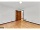 Bedroom featuring hardwood floors, double closet, and doorway at 110 Mourning Dove S Dr, Fayetteville, GA 30215