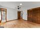 Spacious bedroom features wood floors, a ceiling fan, and double closet at 110 Mourning Dove S Dr, Fayetteville, GA 30215