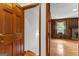 Entryway to living room with wood paneling and a brick fireplace at 110 Mourning Dove S Dr, Fayetteville, GA 30215