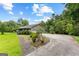 Attractive ranch home with a two-car garage, a paved driveway, and lovely landscaping at 110 Mourning Dove S Dr, Fayetteville, GA 30215
