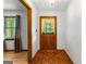 Welcoming foyer with wood floors and a decorative front door with windows at 110 Mourning Dove S Dr, Fayetteville, GA 30215