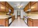 Cozy kitchen featuring wood cabinets and vintage-style flooring at 110 Mourning Dove S Dr, Fayetteville, GA 30215