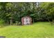 Exterior shot of storage shed with double doors in the backyard at 110 Mourning Dove S Dr, Fayetteville, GA 30215