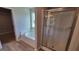 Bathroom featuring a soaking tub, separate glass-enclosed shower, and modern finishes at 45 Duffy Dr., Mcdonough, GA 30253