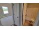 View of a bathroom and bedroom showcasing modern fixtures, flooring, and finishes at 45 Duffy Dr., Mcdonough, GA 30253