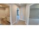 Hallway showcasing access to a bathroom and bedroom, featuring neutral walls and carpeted floors at 45 Duffy Dr., Mcdonough, GA 30253
