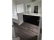 Bathroom showcasing double vanity sinks, a soaking tub, and modern lighting at 5753 Barrington Run # 114, Union City, GA 30291