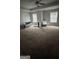 Large bedroom featuring neutral carpeting, natural light, and versatile layout at 5753 Barrington Run # 114, Union City, GA 30291