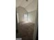 Bright bedroom featuring a window, neutral carpeting, and vaulted ceilings at 5753 Barrington Run # 114, Union City, GA 30291