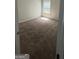 Cozy bedroom with a window allowing natural light and neutral carpeting at 5753 Barrington Run # 114, Union City, GA 30291