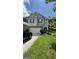 Charming two-story home with neutral siding, black shutters and a two car garage in a suburban neighborhood at 5753 Barrington Run # 114, Union City, GA 30291