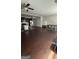 Open kitchen and dining area with modern appliances, wood floors, and lots of natural light at 5753 Barrington Run # 114, Union City, GA 30291