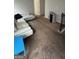 Bright living room featuring a modern sectional couch and plush carpeting at 5753 Barrington Run # 114, Union City, GA 30291