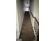 Carpeted stairway leading to the upper level, ready for a new home owner's design touches at 5753 Barrington Run # 114, Union City, GA 30291