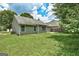 Well-maintained backyard featuring lush lawn and the rear exterior of a home at 1735 Deer Crossing Cir, Jonesboro, GA 30236