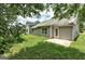 Exterior backyard featuring siding, concrete patio, and green lawn at 1735 Deer Crossing Cir, Jonesboro, GA 30236