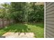 Lush backyard featuring greenery, grass, and privacy fence at 1735 Deer Crossing Cir, Jonesboro, GA 30236