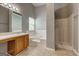 Bathroom featuring a shower, tub, neutral tile floor, and wood vanity at 1735 Deer Crossing Cir, Jonesboro, GA 30236