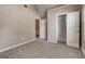 Bright bedroom featuring vaulted ceiling, plush carpet and a closet at 1735 Deer Crossing Cir, Jonesboro, GA 30236
