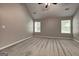 Carpeted main bedroom with neutral walls, large windows, and vaulted ceiling at 1735 Deer Crossing Cir, Jonesboro, GA 30236