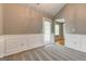 Inviting dining room featuring wainscoting and a door leading to the backyard at 1735 Deer Crossing Cir, Jonesboro, GA 30236