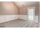 Cozy dining room featuring white wainscoting, new carpet and a chandelier at 1735 Deer Crossing Cir, Jonesboro, GA 30236