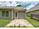 Backyard view featuring siding, concrete patio, and green lawn at 1735 Deer Crossing Cir, Jonesboro, GA 30236