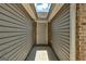 Exterior of home entrance showing covered front door with brick and siding at 1735 Deer Crossing Cir, Jonesboro, GA 30236