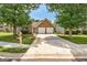 Well-maintained brick home featuring a two-car garage and driveway at 1735 Deer Crossing Cir, Jonesboro, GA 30236