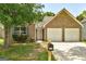 Charming brick home featuring a two-car garage and well-maintained front yard at 1735 Deer Crossing Cir, Jonesboro, GA 30236